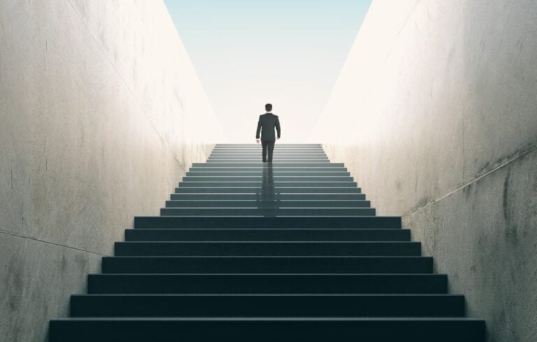 businessman climbing stairs