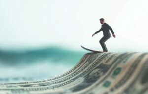 Businessman miniature surfing on a dollar bill wave