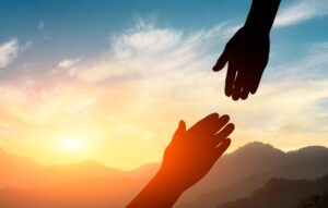 helping hand with the sky sunset background