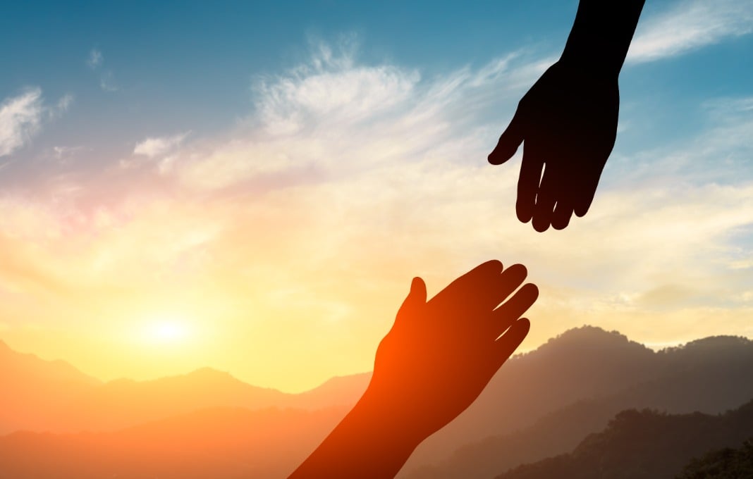 helping hand with the sky sunset background