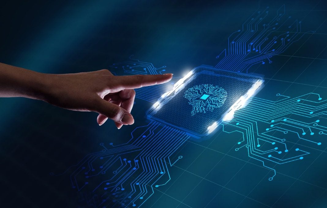 Hand reaching out to computer circuit