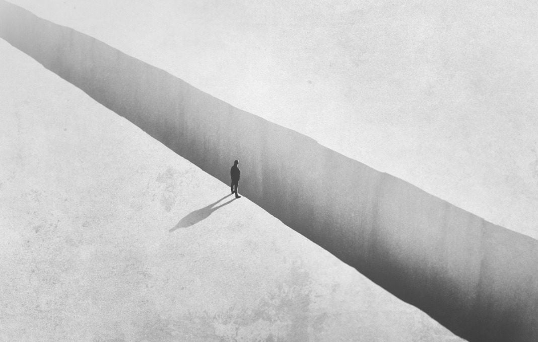 Illustration of man walking on the edge