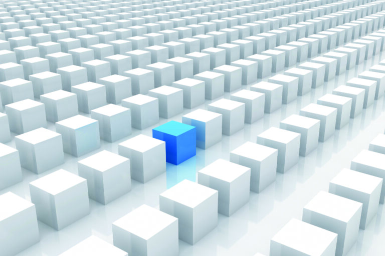 One blue cube stands out amid rows of white cubes