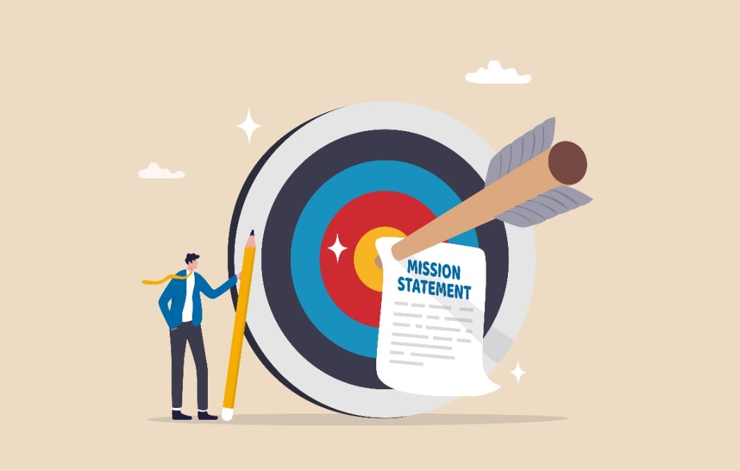 Illustration of businessman standing next to arrow hitting mission statement on bullseye