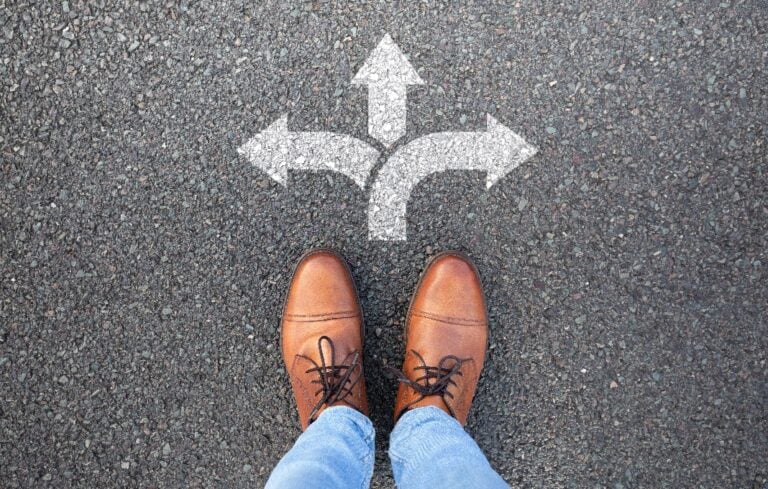 Man standing at the crossroads of a decision